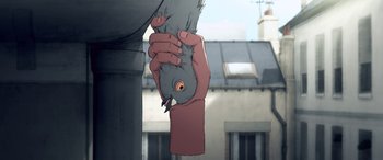 Movie still from “I Lost My Body” (2019), directed by Jérémy Clapin – A person holding onto a pigeon with a building in the background; Extreme Close Up shot, Low angle