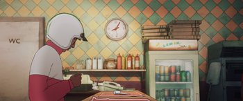 Movie still from “I Lost My Body” (2019), directed by Jérémy Clapin – A person wearing a helmet in a kitchen; Medium shot, High angle