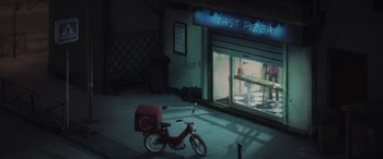 Movie still from “I Lost My Body” (2019), directed by Jérémy Clapin – A bike parked in front of a fast pizza shop at night; Extreme Wide shot, High angle
