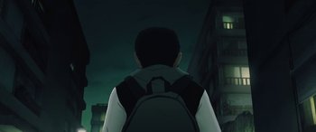 Movie still from “I Lost My Body” (2019), directed by Jérémy Clapin – A man with a backpack standing in front of a building at night; Close Up shot, Low angle