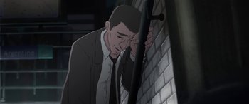 Movie still from “I Lost My Body” (2019), directed by Jérémy Clapin – An animated picture of a man leaning against a brick wall; Close Up shot, High angle