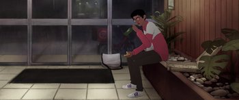 Movie still from “I Lost My Body” (2019), directed by Jérémy Clapin – A man sitting on a bench eating a sandwich; Wide shot, High angle