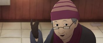 Movie still from “I Lost My Body” (2019), directed by Jérémy Clapin – An older woman wearing a hat and gloves; Close Up shot, High angle