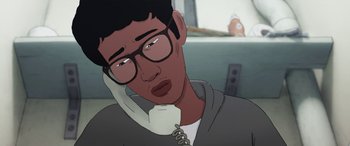 Movie still from “I Lost My Body” (2019), directed by Jérémy Clapin – An animated man talking on a phone while wearing glasses; Close Up shot, Over the shoulder angle