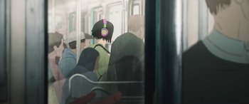 Movie still from “I Lost My Body” (2019), directed by Jérémy Clapin – A person with headphones on riding on a train; Close Up shot, Over the shoulder angle