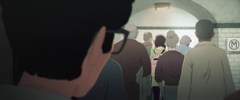 Movie still from “I Lost My Body” (2019), directed by Jérémy Clapin – A group of people standing on a train platform; Extreme Close Up shot, Over the shoulder angle