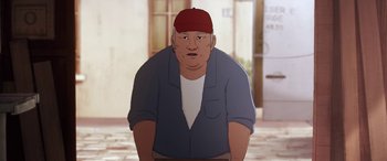 Movie still from “I Lost My Body” (2019), directed by Jérémy Clapin – An animated man wearing a red hat and a blue shirt; Close Up shot, Low angle