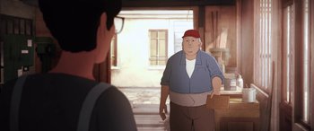 Movie still from “I Lost My Body” (2019), directed by Jérémy Clapin – An animated man in a red hat is talking to a man in a blue shirt; Wide shot, Over the shoulder angle