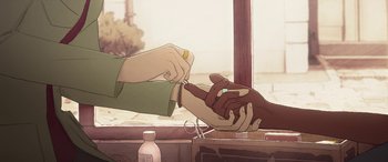 Movie still from “I Lost My Body” (2019), directed by Jérémy Clapin – Two people are holding hands while one is cutting the other's nails; Extreme Close Up shot, Overhead angle