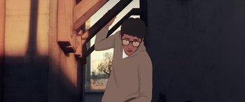 Movie still from “I Lost My Body” (2019), directed by Jérémy Clapin – An illustration of a man wearing glasses and a sweater; Medium shot, Low angle