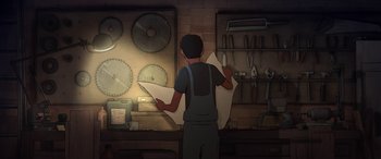 Movie still from “I Lost My Body” (2019), directed by Jérémy Clapin – A man holding a sheet of paper standing in front of a wall of circular saw blades; Wide shot, High angle