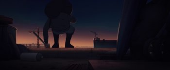 Movie still from “I Lost My Body” (2019), directed by Jérémy Clapin – A person standing on the side of a building at night; Extreme Wide shot, Low angle