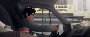 Movie still from “I Lost My Body” (2019), directed by Jérémy Clapin – A man driving in a car while holding a steering wheel; Medium shot, Over the shoulder angle