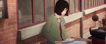 Movie still from “I Lost My Body” (2019), directed by Jérémy Clapin – A woman wearing headphones and reading a book; Medium shot, High angle