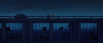 Movie still from “I Lost My Body” (2019), directed by Jérémy Clapin – Two people sitting on a balcony at night; Extreme Wide shot, Low angle
