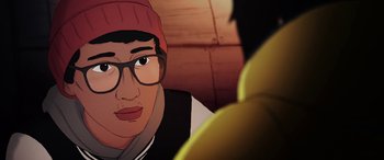 Movie still from “I Lost My Body” (2019), directed by Jérémy Clapin – A man wearing glasses and a hat is looking at a banana; Close Up shot, Over the shoulder angle