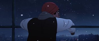 Movie still from “I Lost My Body” (2019), directed by Jérémy Clapin – A man in a red hat and glasses is pointing at the sky; Medium shot, Low angle