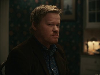 Movie still from “I'm Thinking of Ending Things” (2020), directed by Charlie Kaufman – A man in a brown jacket and a blue tie; Close Up shot, Over the shoulder angle
