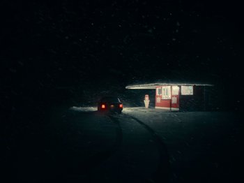 Movie still from “I'm Thinking of Ending Things” (2020), directed by Charlie Kaufman – A car parked in front of a building in the dark; Extreme Wide shot, Low angle
