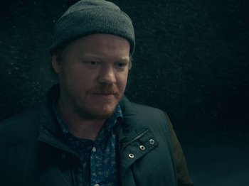Movie still from “I'm Thinking of Ending Things” (2020), directed by Charlie Kaufman – A person wearing a jacket and a hat; Close Up shot, High angle