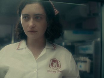 Movie still from “I'm Thinking of Ending Things” (2020), directed by Charlie Kaufman – A woman in a white shirt and a red tie; Close Up shot, Over the shoulder angle