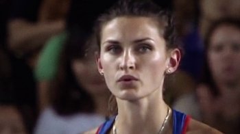 Movie still from “Icarus” (2017), directed by Bryan Fogel – A woman's face in front of a group of people; Close Up shot, Low angle