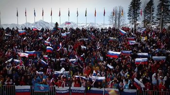 Movie still from “Icarus” (2017), directed by Bryan Fogel – A large crowd of people are gathered in a stadium; Extreme Wide shot, High angle