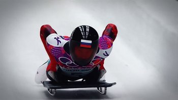 Movie still from “Icarus” (2017), directed by Bryan Fogel – A man riding down the side of a hill on top of a snowboard; Medium shot, Low angle