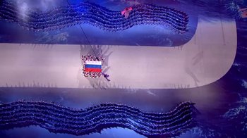 Movie still from “Icarus” (2017), directed by Bryan Fogel – A group of people standing on top of each other in a room; Extreme Wide shot, Overhead angle