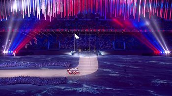 Movie still from “Icarus” (2017), directed by Bryan Fogel – A group of people standing on a stage in front of a crowd; Extreme Wide shot, High angle