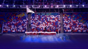 Movie still from “Icarus” (2017), directed by Bryan Fogel – A group of people standing in front of an audience; Extreme Wide shot, High angle