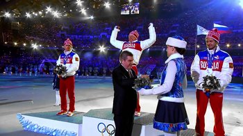 Movie still from “Icarus” (2017), directed by Bryan Fogel – A group of people standing on a stage in front of a crowd; Wide shot, Low angle
