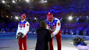 Movie still from “Icarus” (2017), directed by Bryan Fogel – A group of men standing next to each other on a field; Wide shot, Low angle