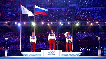 Movie still from “Icarus” (2017), directed by Bryan Fogel – A group of men standing on top of a stage; Extreme Wide shot, Low angle