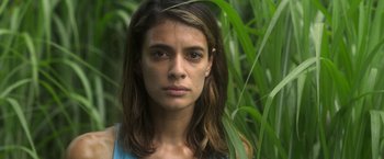 Movie still from “In the Tall Grass” (2019), directed by Vincenzo Natali – A person with long hair; Close Up shot, High angle