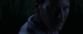 Movie still from “In the Tall Grass” (2019), directed by Vincenzo Natali – A person's face in the dark; Close Up shot, Low angle