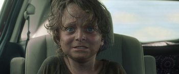 Movie still from “In the Tall Grass” (2019), directed by Vincenzo Natali – A child's face with dirt on it; Close Up shot, Low angle