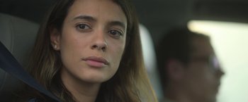 Movie still from “In the Tall Grass” (2019), directed by Vincenzo Natali – A person with long hair; Close Up shot, Low angle