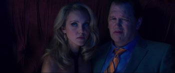 Movie still from “Incarnate” (2016), directed by Brad Peyton – A man and a woman are posing for a picture; Close Up shot, Low angle