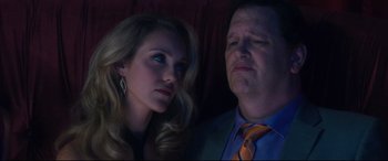 Movie still from “Incarnate” (2016), directed by Brad Peyton – A man and a woman looking at the camera; Close Up shot, Low angle