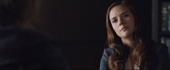 Movie still from “Incarnate” (2016), directed by Brad Peyton – A beautiful young woman with long brown hair; Close Up shot, Over the shoulder angle