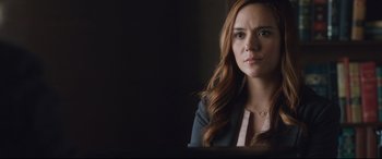 Movie still from “Incarnate” (2016), directed by Brad Peyton – A woman sitting in front of a computer screen; Close Up shot, Over the shoulder angle