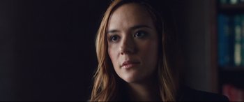 Movie still from “Incarnate” (2016), directed by Brad Peyton – A person with long hair; Close Up shot, Low angle