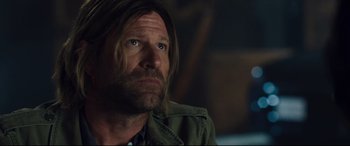 Movie still from “Incarnate” (2016), directed by Brad Peyton – A person with long hair; Close Up shot, Over the shoulder angle