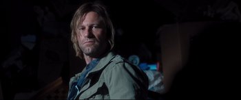 Movie still from “Incarnate” (2016), directed by Brad Peyton – A person wearing a shirt and jacket; Close Up shot, Over the shoulder angle