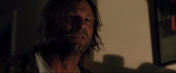 Movie still from “Incarnate” (2016), directed by Brad Peyton – A person with long hair; Close Up shot, Low angle