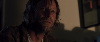 Movie still from “Incarnate” (2016), directed by Brad Peyton – A person with long dark hair; Close Up shot, Low angle