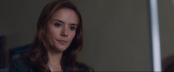 Movie still from “Incarnate” (2016), directed by Brad Peyton – A person with long brown hair; Close Up shot, Over the shoulder angle