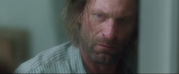 Movie still from “Incarnate” (2016), directed by Brad Peyton – A person with long hair; Close Up shot, Low angle