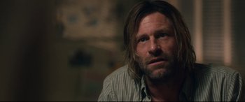 Movie still from “Incarnate” (2016), directed by Brad Peyton – A person with long hair; Close Up shot, Over the shoulder angle